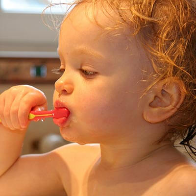 Little Kid Brushing Teeth