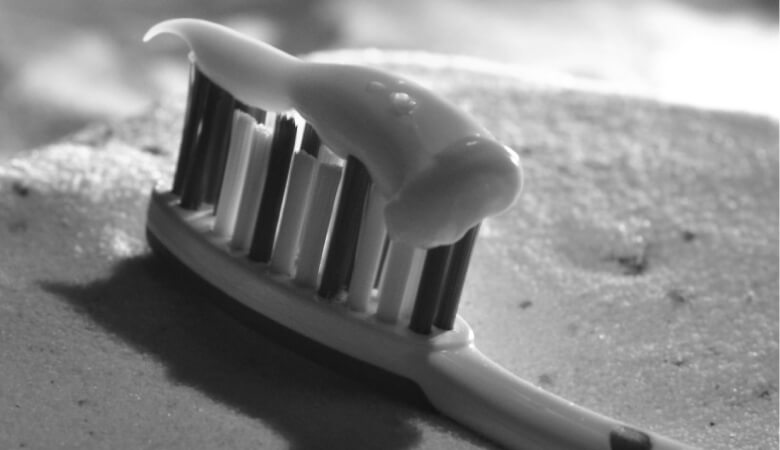 closeup of toothpaste on toothbrush